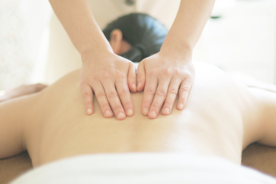 Woman receiving an aroma oil massage